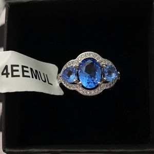 Charm aroma, silver and blue stone ring.